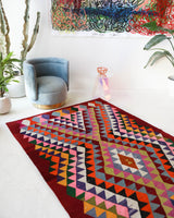 Vintage kilim rug in living room setting, bright colors, wild shaman, soft rug, bold color, Portland, Oregon, rug store, rug shop, local shop, vintage rug, modern kilim, warm colors, antique rug, antique kilim