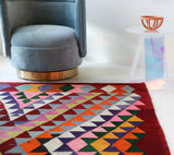 Vintage kilim rug in living room setting, bright colors, wild shaman, soft rug, bold color, Portland, Oregon, rug store, rug shop, local shop, vintage rug, modern kilim, warm colors, antique rug, antique kilim