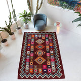 Vintage kilim rug in living room setting, bright colors, wild shaman, soft rug, bold color, Portland, Oregon, rug store, rug shop, local shop, vintage rug, modern kilim, warm colors, antique rug, antique kilim