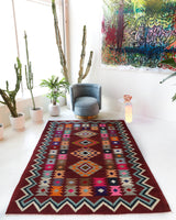Vintage kilim rug in living room setting, bright colors, wild shaman, soft rug, bold color, Portland, Oregon, rug store, rug shop, local shop, vintage rug, modern kilim, warm colors, antique rug, antique kilim