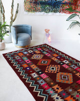 Vintage kilim rug in living room setting, bright colors, wild shaman, soft rug, bold color, Portland, Oregon, rug store, rug shop, local shop, vintage rug, modern kilim, warm colors, antique rug, antique kilim