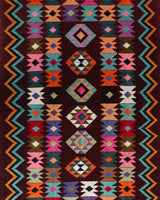 Vintage kilim rug in living room setting, bright colors, wild shaman, soft rug, bold color, Portland, Oregon, rug store, rug shop, local shop, vintage rug, modern kilim, warm colors, antique rug, antique kilim