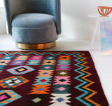 Vintage kilim rug in living room setting, bright colors, wild shaman, soft rug, bold color, Portland, Oregon, rug store, rug shop, local shop, vintage rug, modern kilim, warm colors, antique rug, antique kilim