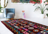 Vintage kilim rug in living room setting, bright colors, wild shaman, soft rug, bold color, Portland, Oregon, rug store, rug shop, local shop, vintage rug, modern kilim, warm colors, antique rug, antique kilim