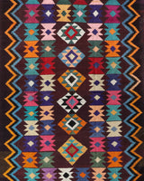 Vintage kilim rug in living room setting, bright colors, wild shaman, soft rug, bold color, Portland, Oregon, rug store, rug shop, local shop, vintage rug, modern kilim, warm colors, antique rug, antique kilim