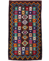 Vintage kilim rug in living room setting, bright colors, wild shaman, soft rug, bold color, Portland, Oregon, rug store, rug shop, local shop, vintage rug, modern kilim, warm colors, antique rug, antique kilim