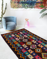 Vintage kilim rug in living room setting, bright colors, wild shaman, soft rug, bold color, Portland, Oregon, rug store, rug shop, local shop, vintage rug, modern kilim, warm colors, antique rug, antique kilim