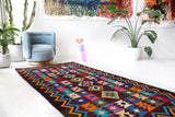 Vintage kilim rug in living room setting, bright colors, wild shaman, soft rug, bold color, Portland, Oregon, rug store, rug shop, local shop, vintage rug, modern kilim, warm colors, antique rug, antique kilim