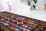 Vintage kilim rug in living room setting, bright colors, wild shaman, soft rug, bold color, Portland, Oregon, rug store, rug shop, local shop, vintage rug, modern kilim, warm colors, antique rug, antique kilim