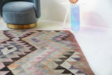 Vintage kilim rug in living room setting, old rug, antique rug, pastel colors, faded colors, Turkish rug, vintage rug, soft rug, Portland, Oregon, rug store, rug shop, local shop, earthy tones, earthy colors, warm colors