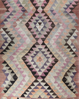 Vintage kilim rug in living room setting, old rug, antique rug, pastel colors, faded colors, Turkish rug, vintage rug, soft rug, Portland, Oregon, rug store, rug shop, local shop, earthy tones, earthy colors, warm colors