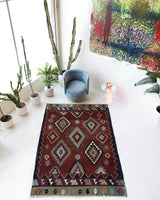 Vintage kilim rug in living room setting, bright colors, wild shaman, soft rug, bold color, Portland, Oregon, rug store, rug shop, local shop, vintage rug, modern kilim, warm colors, antique rug, antique kilim