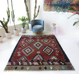 Vintage kilim rug in living room setting, bright colors, wild shaman, soft rug, bold color, Portland, Oregon, rug store, rug shop, local shop, vintage rug, modern kilim, warm colors, antique rug, antique kilim