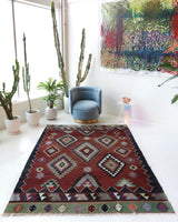 Vintage kilim rug in living room setting, bright colors, wild shaman, soft rug, bold color, Portland, Oregon, rug store, rug shop, local shop, vintage rug, modern kilim, warm colors, antique rug, antique kilim