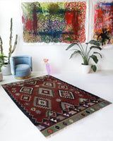 Vintage kilim rug in living room setting, bright colors, wild shaman, soft rug, bold color, Portland, Oregon, rug store, rug shop, local shop, vintage rug, modern kilim, warm colors, antique rug, antique kilim