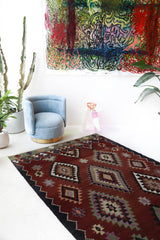 Vintage kilim rug in living room setting, bright colors, wild shaman, soft rug, bold color, Portland, Oregon, rug store, rug shop, local shop, vintage rug, modern kilim, warm colors, antique rug, antique kilim