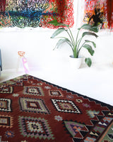 Vintage kilim rug in living room setting, bright colors, wild shaman, soft rug, bold color, Portland, Oregon, rug store, rug shop, local shop, vintage rug, modern kilim, warm colors, antique rug, antique kilim