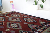Vintage kilim rug in living room setting, bright colors, wild shaman, soft rug, bold color, Portland, Oregon, rug store, rug shop, local shop, vintage rug, modern kilim, warm colors, antique rug, antique kilim