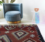 Vintage kilim rug in living room setting, bright colors, wild shaman, soft rug, bold color, Portland, Oregon, rug store, rug shop, local shop, vintage rug, modern kilim, warm colors, antique rug, antique kilim