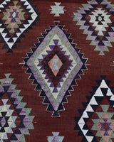 Vintage kilim rug in living room setting, bright colors, wild shaman, soft rug, bold color, Portland, Oregon, rug store, rug shop, local shop, vintage rug, modern kilim, warm colors, antique rug, antique kilim