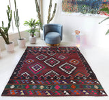 Vintage kilim rug in living room setting, bright colors, wild shaman, soft rug, bold color, Portland, Oregon, rug store, rug shop, local shop, vintage rug, modern kilim, warm colors, antique rug, antique kilim