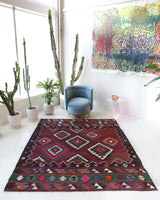 Vintage kilim rug in living room setting, bright colors, wild shaman, soft rug, bold color, Portland, Oregon, rug store, rug shop, local shop, vintage rug, modern kilim, warm colors, antique rug, antique kilim