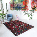 Vintage kilim rug in living room setting, bright colors, wild shaman, soft rug, bold color, Portland, Oregon, rug store, rug shop, local shop, vintage rug, modern kilim, warm colors, antique rug, antique kilim