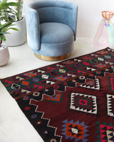 Vintage kilim rug in living room setting, bright colors, wild shaman, soft rug, bold color, Portland, Oregon, rug store, rug shop, local shop, vintage rug, modern kilim, warm colors, antique rug, antique kilim