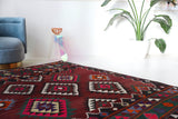 Vintage kilim rug in living room setting, bright colors, wild shaman, soft rug, bold color, Portland, Oregon, rug store, rug shop, local shop, vintage rug, modern kilim, warm colors, antique rug, antique kilim
