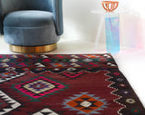 Vintage kilim rug in living room setting, bright colors, wild shaman, soft rug, bold color, Portland, Oregon, rug store, rug shop, local shop, vintage rug, modern kilim, warm colors, antique rug, antique kilim