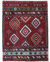 Vintage kilim rug in living room setting, bright colors, wild shaman, soft rug, bold color, Portland, Oregon, rug store, rug shop, local shop, vintage rug, modern kilim, warm colors, antique rug, antique kilim