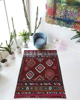 Vintage kilim rug in living room setting, bright colors, wild shaman, soft rug, bold color, Portland, Oregon, rug store, rug shop, local shop, vintage rug, modern kilim, warm colors, antique rug, antique kilim
