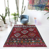 Vintage kilim rug in living room setting, bright colors, wild shaman, soft rug, bold color, Portland, Oregon, rug store, rug shop, local shop, vintage rug, modern kilim, warm colors, antique rug, antique kilim