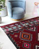 Vintage kilim rug in living room setting, bright colors, wild shaman, soft rug, bold color, Portland, Oregon, rug store, rug shop, local shop, vintage rug, modern kilim, warm colors, antique rug, antique kilim