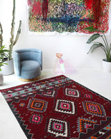 Vintage kilim rug in living room setting, bright colors, wild shaman, soft rug, bold color, Portland, Oregon, rug store, rug shop, local shop, vintage rug, modern kilim, warm colors, antique rug, antique kilim