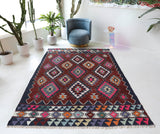 Vintage kilim rug in living room setting, bright colors, wild shaman, soft rug, bold color, Portland, Oregon, rug store, rug shop, local shop, vintage rug, modern kilim, warm colors, antique rug, antique kilim