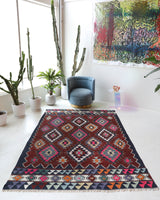 Vintage kilim rug in living room setting, bright colors, wild shaman, soft rug, bold color, Portland, Oregon, rug store, rug shop, local shop, vintage rug, modern kilim, warm colors, antique rug, antique kilim