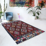 Vintage kilim rug in living room setting, bright colors, wild shaman, soft rug, bold color, Portland, Oregon, rug store, rug shop, local shop, vintage rug, modern kilim, warm colors, antique rug, antique kilim