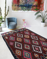 Vintage kilim rug in living room setting, bright colors, wild shaman, soft rug, bold color, Portland, Oregon, rug store, rug shop, local shop, vintage rug, modern kilim, warm colors, antique rug, antique kilim