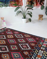 Vintage kilim rug in living room setting, bright colors, wild shaman, soft rug, bold color, Portland, Oregon, rug store, rug shop, local shop, vintage rug, modern kilim, warm colors, antique rug, antique kilim