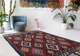 Vintage kilim rug in living room setting, bright colors, wild shaman, soft rug, bold color, Portland, Oregon, rug store, rug shop, local shop, vintage rug, modern kilim, warm colors, antique rug, antique kilim