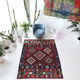 Vintage kilim rug in living room setting, bright colors, wild shaman, soft rug, bold color, Portland, Oregon, rug store, rug shop, local shop, vintage rug, modern kilim, warm colors, antique rug, antique kilim
