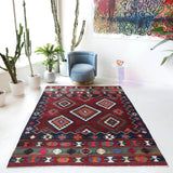 Vintage kilim rug in living room setting, bright colors, wild shaman, soft rug, bold color, Portland, Oregon, rug store, rug shop, local shop, vintage rug, modern kilim, warm colors, antique rug, antique kilim