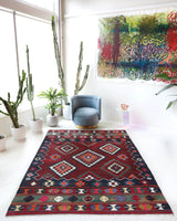 Vintage kilim rug in living room setting, bright colors, wild shaman, soft rug, bold color, Portland, Oregon, rug store, rug shop, local shop, vintage rug, modern kilim, warm colors, antique rug, antique kilim