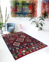 Vintage kilim rug in living room setting, bright colors, wild shaman, soft rug, bold color, Portland, Oregon, rug store, rug shop, local shop, vintage rug, modern kilim, warm colors, antique rug, antique kilim
