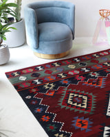 Vintage kilim rug in living room setting, bright colors, wild shaman, soft rug, bold color, Portland, Oregon, rug store, rug shop, local shop, vintage rug, modern kilim, warm colors, antique rug, antique kilim