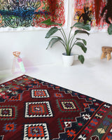 Vintage kilim rug in living room setting, bright colors, wild shaman, soft rug, bold color, Portland, Oregon, rug store, rug shop, local shop, vintage rug, modern kilim, warm colors, antique rug, antique kilim