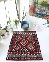 Vintage kilim rug in living room setting, bright colors, wild shaman, soft rug, bold color, Portland, Oregon, rug store, rug shop, local shop, vintage rug, modern kilim, warm colors, antique rug, antique kilim