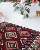 Vintage kilim rug in living room setting, bright colors, wild shaman, soft rug, bold color, Portland, Oregon, rug store, rug shop, local shop, vintage rug, modern kilim, warm colors, antique rug, antique kilim