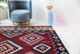Vintage kilim rug in living room setting, bright colors, wild shaman, soft rug, bold color, Portland, Oregon, rug store, rug shop, local shop, vintage rug, modern kilim, warm colors, antique rug, antique kilim